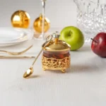 Recipiente para miel de cristal con metal color oro